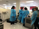 Dental assisting school students and faculty member in lab classroom