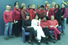 Group of people wearing red, looking at camera