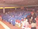 Graduates file into auditorium