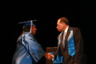 Faculty member congratulates graduate