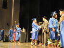 Graduates onstage to receive their degrees 