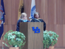 Two faculty members address the audience