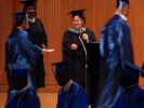 Graduate receives their degree from faculty