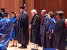 Faculty members congratulate graduates