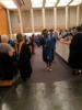 Graduates line up to receive their degrees