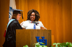 Margot Keysor (left) presents the Distinguished Alumni Award to Charmaine Leonard at the UB Educational Opportunity Center's (UBEOC) 44th Annual Commencement on May 24, 2017 in Slee Hall. Photographer: Meredith Forrest Kulwicki