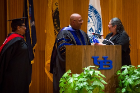 Julius Gregg Adams (center) Mary Craig present the Friend of EOC award to prepresentative of St. Luke's Mission of Mercy at the UB Educational Opportunity Center's (UBEOC) 44th Annual Commencement on May 24, 2017 in Slee Hall. Photographer: Meredith Forrest Kulwicki
