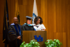 Margot Keysor (center) and Julius Gregg Adams (left) present the Distinguished Alumni Award to Charmaine Leonard at the UB Educational Opportunity Center's (UBEOC) 44th Annual Commencement on May 24, 2017 in Slee Hall. Photographer: Meredith Forrest Kulwicki