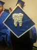 Graduation cap decorated with a tooth