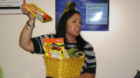 person holding a basket of food and other items