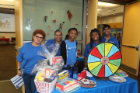 Volunteers with prize wheel