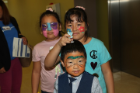 Three kids in face paint