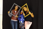 three people posing for picture with frames