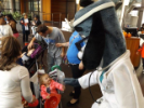 Baby in stroller with mascot