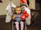 Girl in stroller with balloon animal