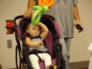 Child in stroller with balloon animal