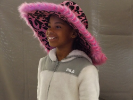 Smiling child in pink hat