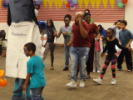 Families dance with mascot