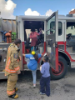 Kids board fire truck