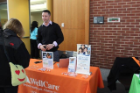 Volunteer at WellCare table
