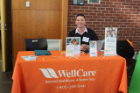 Volunteer at WellCare table