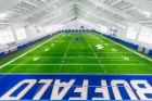 The UB Football team practices in the new Murchie Family Fieldhouse on the North Capus of University at Buffalo in April 2019. Photographer: Paul Hokanson