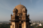 This is one of the four corner towers of a temple in Bijapur. We woke early to visit the site before it became busy with school children because the top of the temple amplifies sound and carries voices around the dome which is spectacular but loud! | Photo Credit: Xander Covert