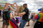People gather to celebrate the ribbon cutting ceremony for the new rainbow crosswalk near the Student Union on North Campus in August 2019. The rainbow crosswalk involved Campus Living, Intercultural and Diversity Center, and the Office of Inclusive Excellence. Photographer: Meredith Forrest Kulwicki