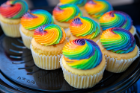 A tray of cupcakes with rainbow frosting from the event. Photographer: Meredith Forrest Kulwicki