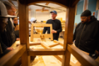 Jim Cordes, woodworking artist-in-residence at the Roycroft Campus in East Aurora, N.Y., gives a lesson to students in the spring term of the SACRA program in mid-May. Photo: Douglas Levere