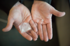 The largest and smallest crystals submitted to the contest in 2017. The largest is about 73 grams. The smallest is 0.56 grams, just large enough not to be disqualified by what competition organizer and UB chemistry professor Jason Benedict calls the "Jose" rule, which sets the minimum crystal size at 0.5 grams. The rule is named for an undergraduate who won a trial contest — which Benedict staged for members of his lab several years ago — by growing a nearly perfect but miniscule crystal. Credit: Meredith Forrest Kulwicki / University at Buffalo