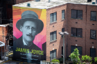 The UB Libraries is celebrating Bloomsday with the creation of a vibrant mural of renowned author and poet James Joyce in downtown Buffalo. Photographer: Meredith Forrest Kulwicki