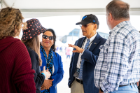 President Tripathi and Mrs. Tripathi greeting families at the UB Stadium during the homecoming game in October 2021. Photographer: Meredith Forrest Kulwicki