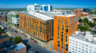 Aerial image of the exterior of the Jacobs School of Medicine and Biomedical Sciences in downtown Buffalo, NY photographed in August 2021. Photographer: Douglas Levere