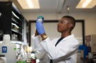 Alozie prepares to measure the concentration of bacteria in water at Sassoubre’s lab in Jarvis Hall on UB’s North Campus.