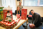 Gifts are wrapped for Adopt-A-Family participants. Photo: Douglas Levere