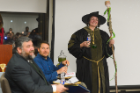Pharmacy faculty member Alice Ceacareanu dresses the part of a sorcerer as she gives her pitch. Seated are, from left, Patrick McDevitt and Jason Briner. Photo: Nancy J. Parisi