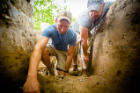 From left: Dan Snyder and Trevor Totman work at the dig site. Photo: Douglas Levere