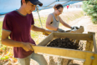 Anthropology students Sal Sciascia and Beccy Biermann shake out the dirt. Photo: Douglas Levere