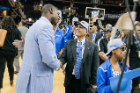 Athletics Director Allen Greene and President Satish K. Tripathi meet after the game. Photo: Paul Hokanson
