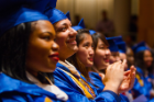 Students in caps and gowns enjoy UB's 20th Annual ALANA Celebration of Achievement, a pre-commencement ceremony.