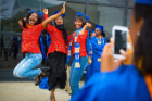 Graduating students celebrated with leaps of joy outside of UB's 20th Annual ALANA Celebration of Achievement, a pre-commencement ceremony.