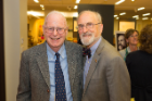 Claude Welch with Reed Taylor, left, a former English teacher at Amherst High and Nichols School. Taylor taught three of Welch's four children at Amherst High School. Taylor attended the academic panel and reception held last week to honor Welch on his retirement from UB. Photo: Douglas Levere