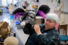 Cindy Darling, assistant costume shop manager, holds the half-human/half-donkey head belonging to Bottom in “A Midsummer Night’s Dream.”