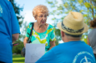 Marie Schillo talks with Howard Henry, who was staffing University Presbyterian Church's information table.