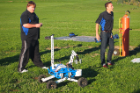 From left: Graduate students Kyle Thompson, electrical engineering, and Livio Forte III, mechanical and aerospace engineering, get the remote-controlled rover ready for a demonstration.