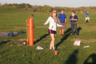 Maura Sutherland (foreground), a junior double-majoring in aerospace and mechanical engineering, helps gather the UB Nanosatellite Lab troops to conduct an experiment with a weather balloon.
