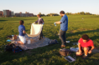 From left: Brian Bezanson, Mara Boardman and Andrew Dianetti, all members of the Nanosatellite Lab, prepare the balloon for launch.
