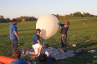 From left: Andrew Dianetti, Mara Boardman and Brian Bezanson fill the balloon.