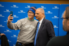 Undergrad Richard Guo takes a selfie with Holder.